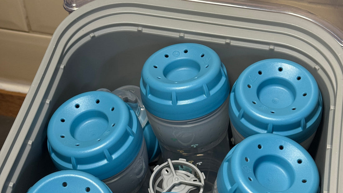 Six MAM bottles loaded in the Bebello bottle washer